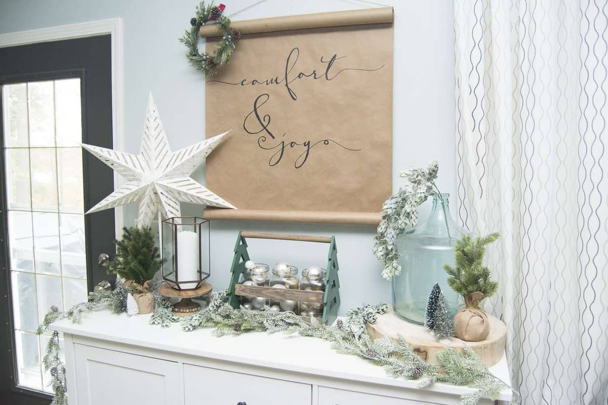 If you're looking for simple and affordable Christmas decor, look no further than this easy DIY Christmas scroll art! This project takes less than 1 hour!