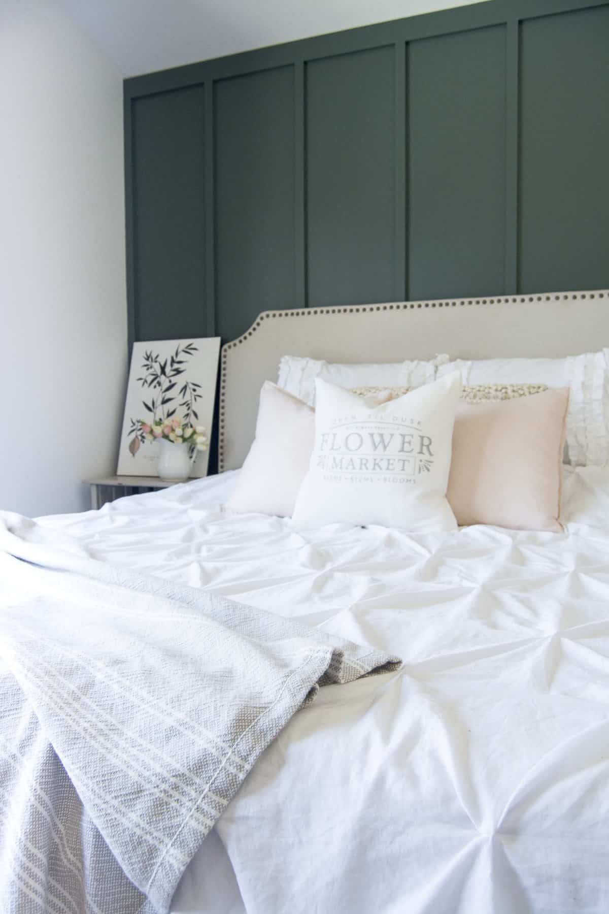 A master bedroom should be your oasis! That is exactly what I created when I installed a modern farmhouse bedroom accent wall. Head to the blog to see my master bedroom retreat and to get the tutorial and paint sources!