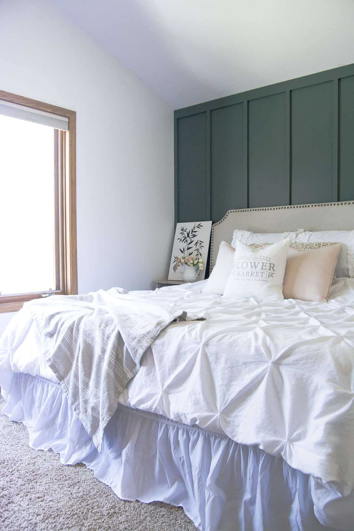 A master bedroom should be your oasis! That is exactly what I created when I installed a modern farmhouse bedroom accent wall. Head to the blog to see my master bedroom retreat and to get the tutorial and paint sources!