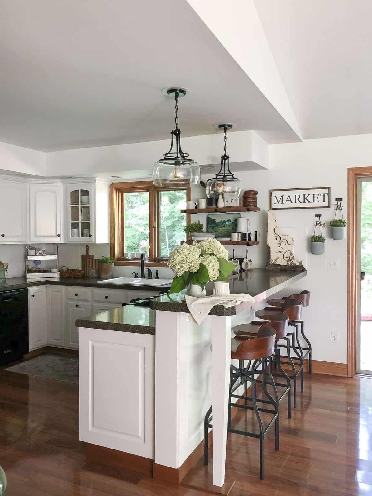 Kitchen Remodel on a Budget | The final reveal of our budget friendly kitchen remodel along with a DIY pendant makeover and beautiful kitchen decor ideas.