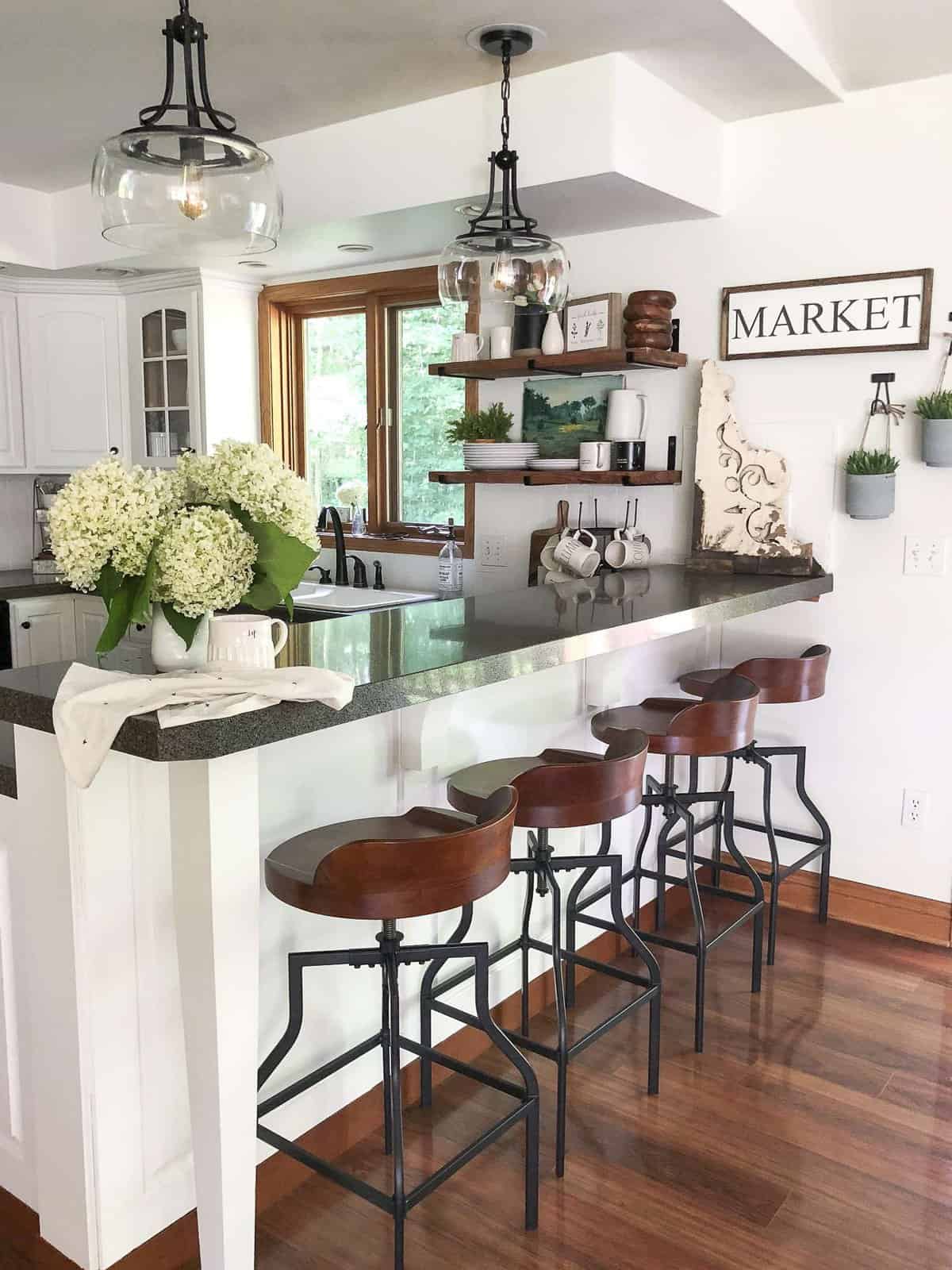 Kitchen Remodel on a Budget | The final reveal of our budget friendly kitchen remodel along with a DIY pendant makeover and beautiful kitchen decor ideas.