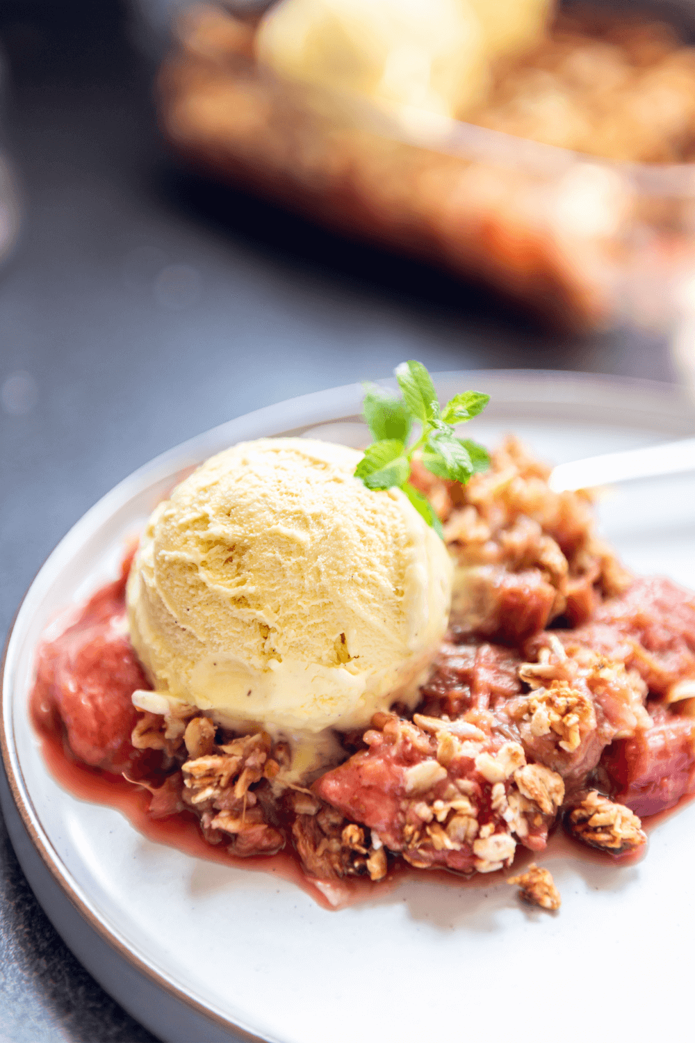 Plated strawberry rhubarb crisp.