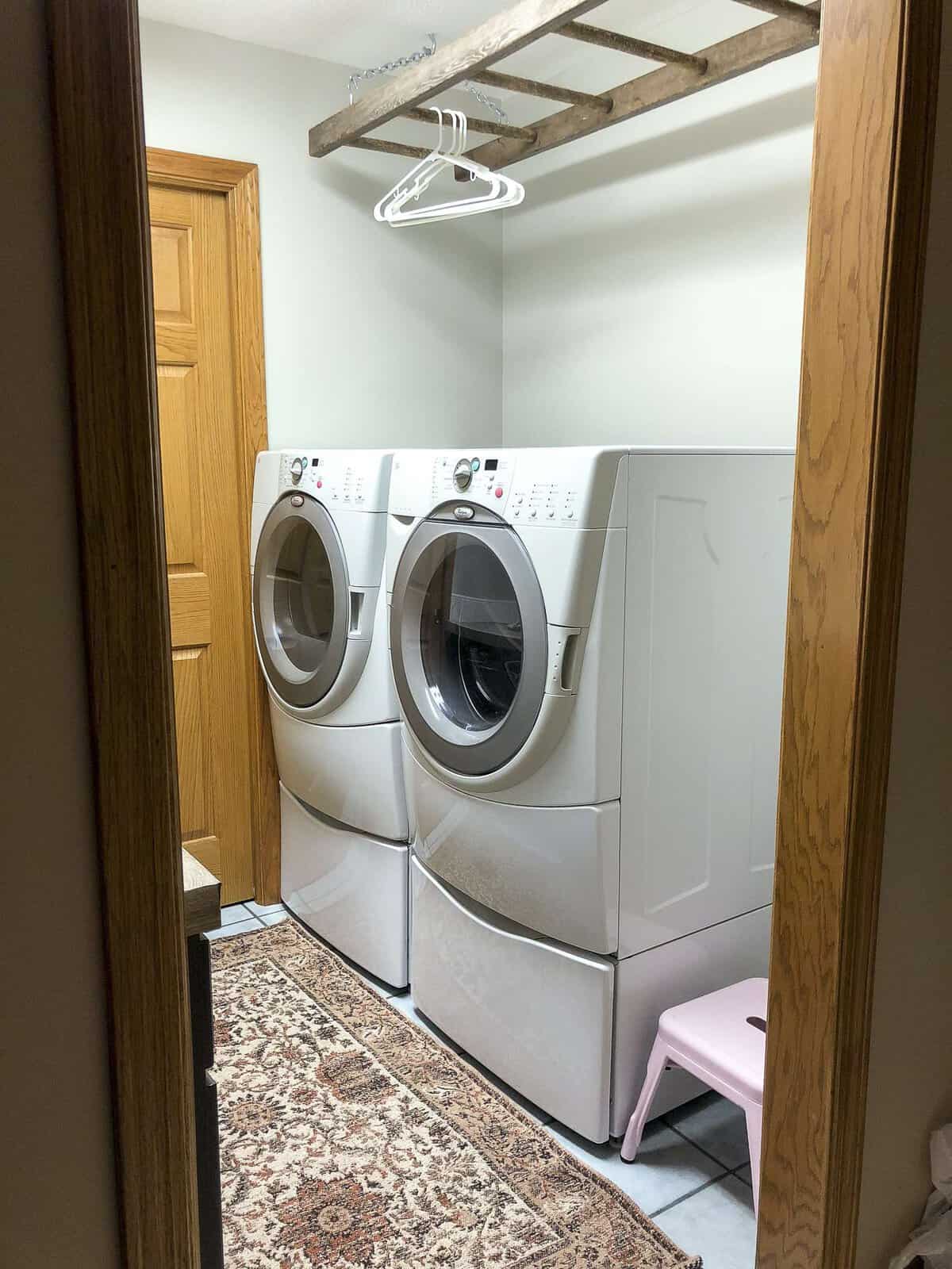 Is your laundry room in need of a facelift? See how I take my laundry room decor and more from dark and dated to beautiful form and function, all for $100!