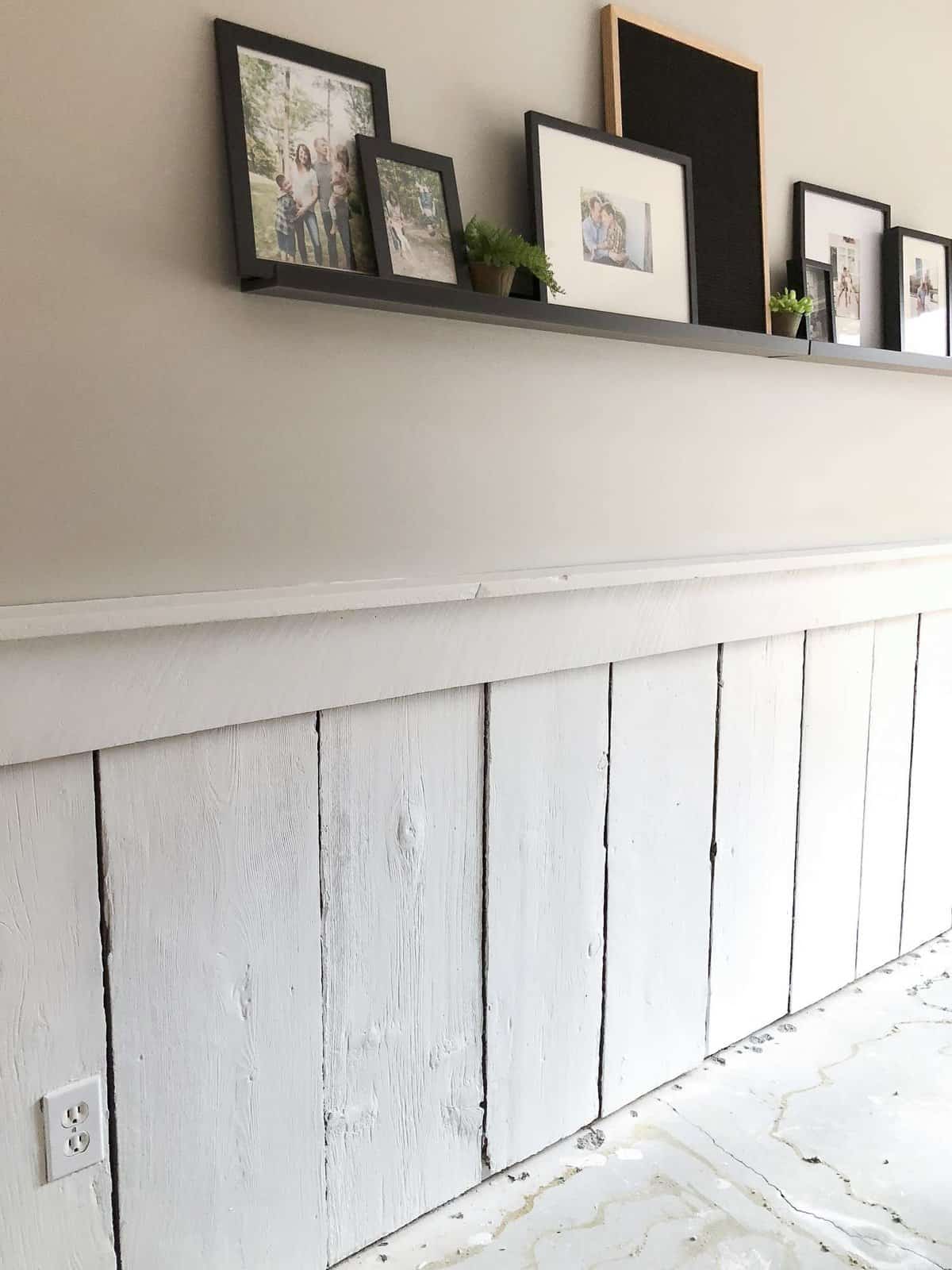 Come see how I took a rustic barnwood wall and transformed it into a more modern accent in our basement remodel for less than $40! #barnwoodwall #diyproject #basementremodel