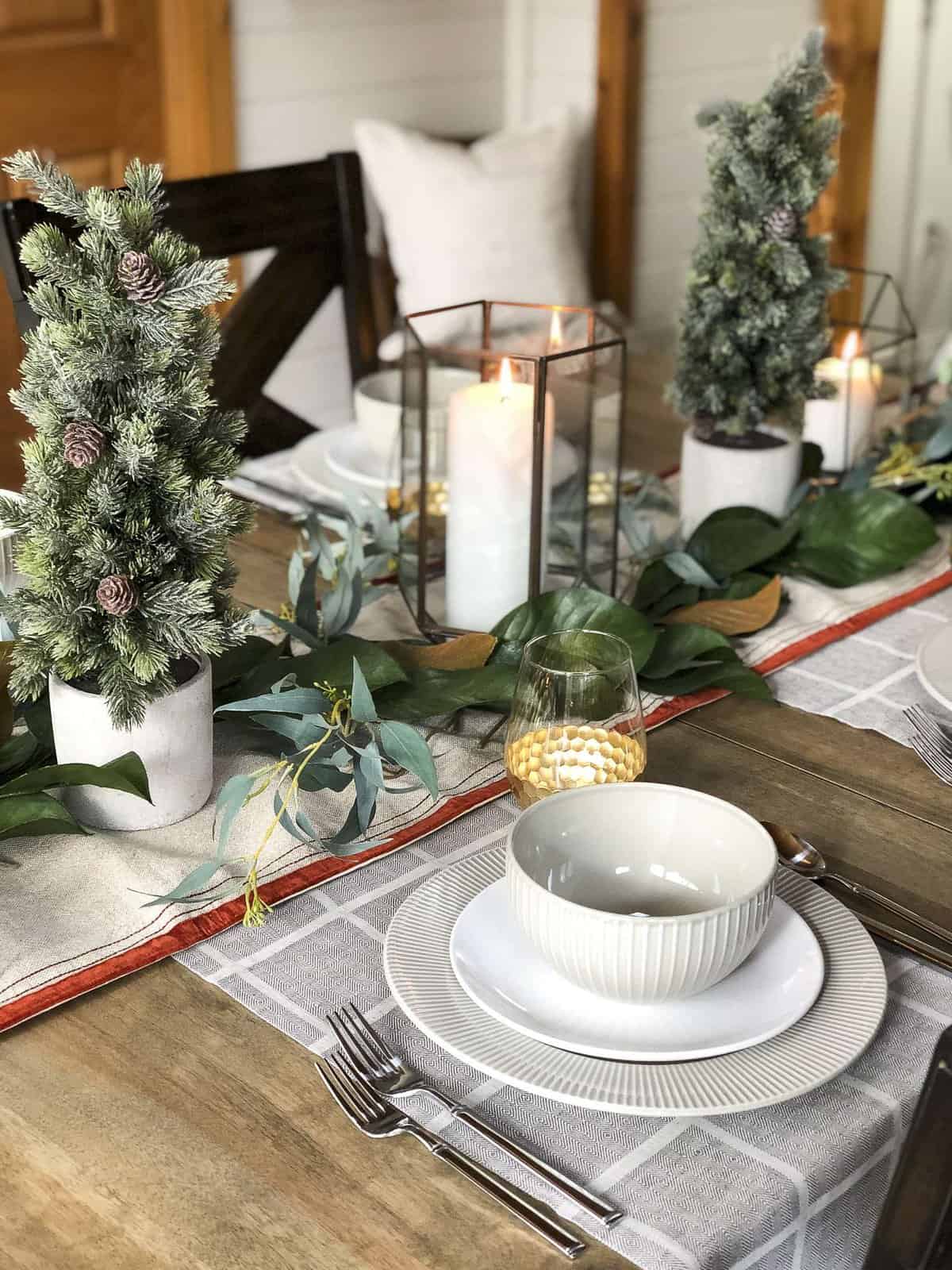 Are you planning a holiday get together? No need to buy Christmas dishes! Here are a few tips on how to use everyday dishes for your holiday table decor. #holidaytabledecor #christmasdecor
