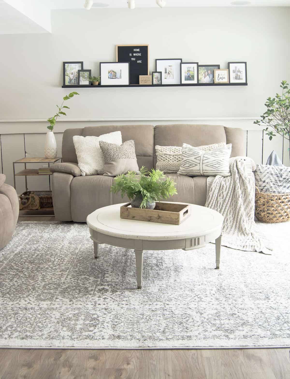 Do you struggle to keep your family room pretty and practical? Today I'm sharing my family room design and how I make it work for an active family of four. #fromhousetohaven #familyroomdesign #livingroom #homedecor