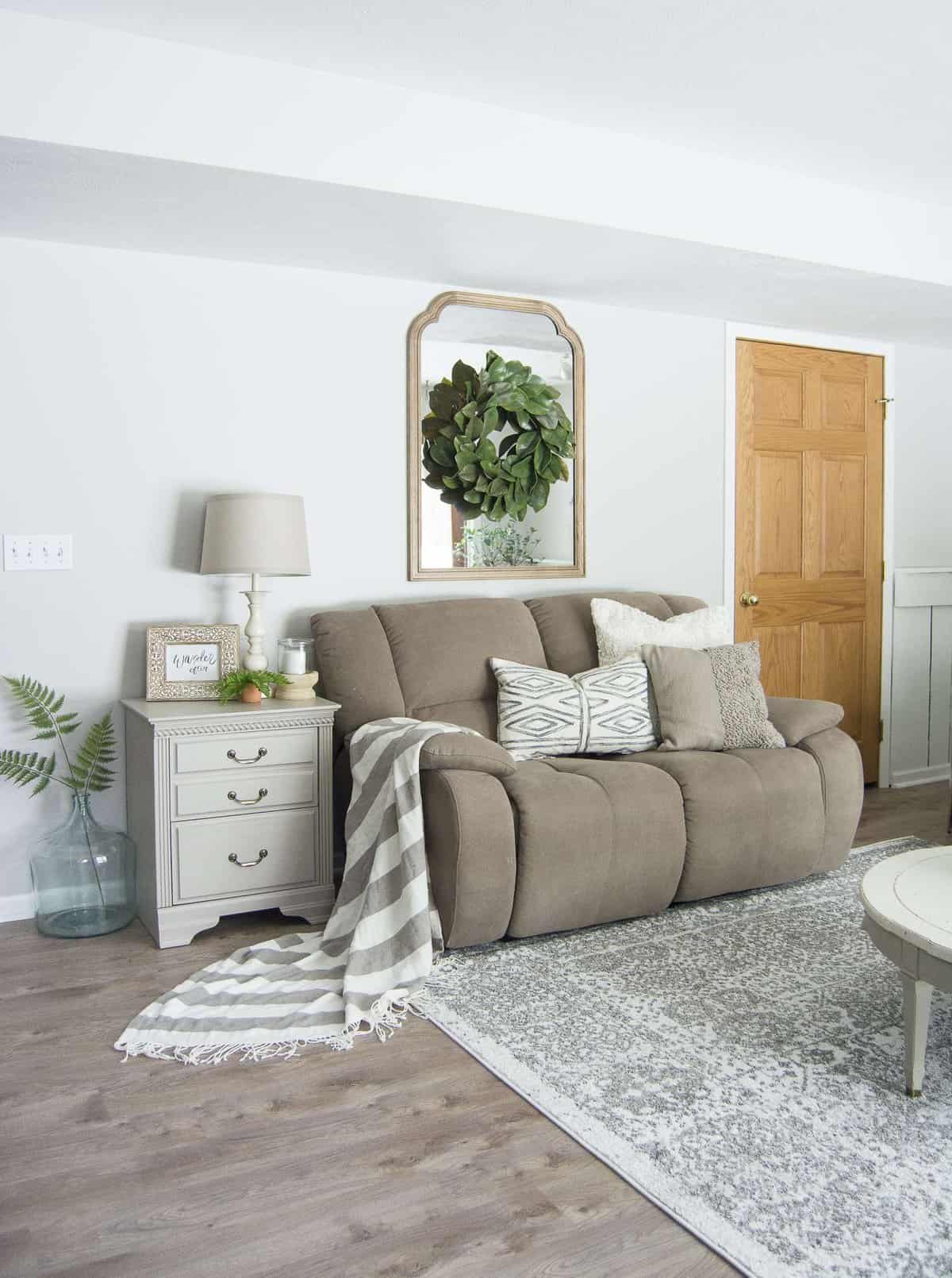 Do you struggle to keep your family room pretty and practical? Today I'm sharing my family room design and how I make it work for an active family of four. #fromhousetohaven #familyroomdesign #livingroom #homedecor