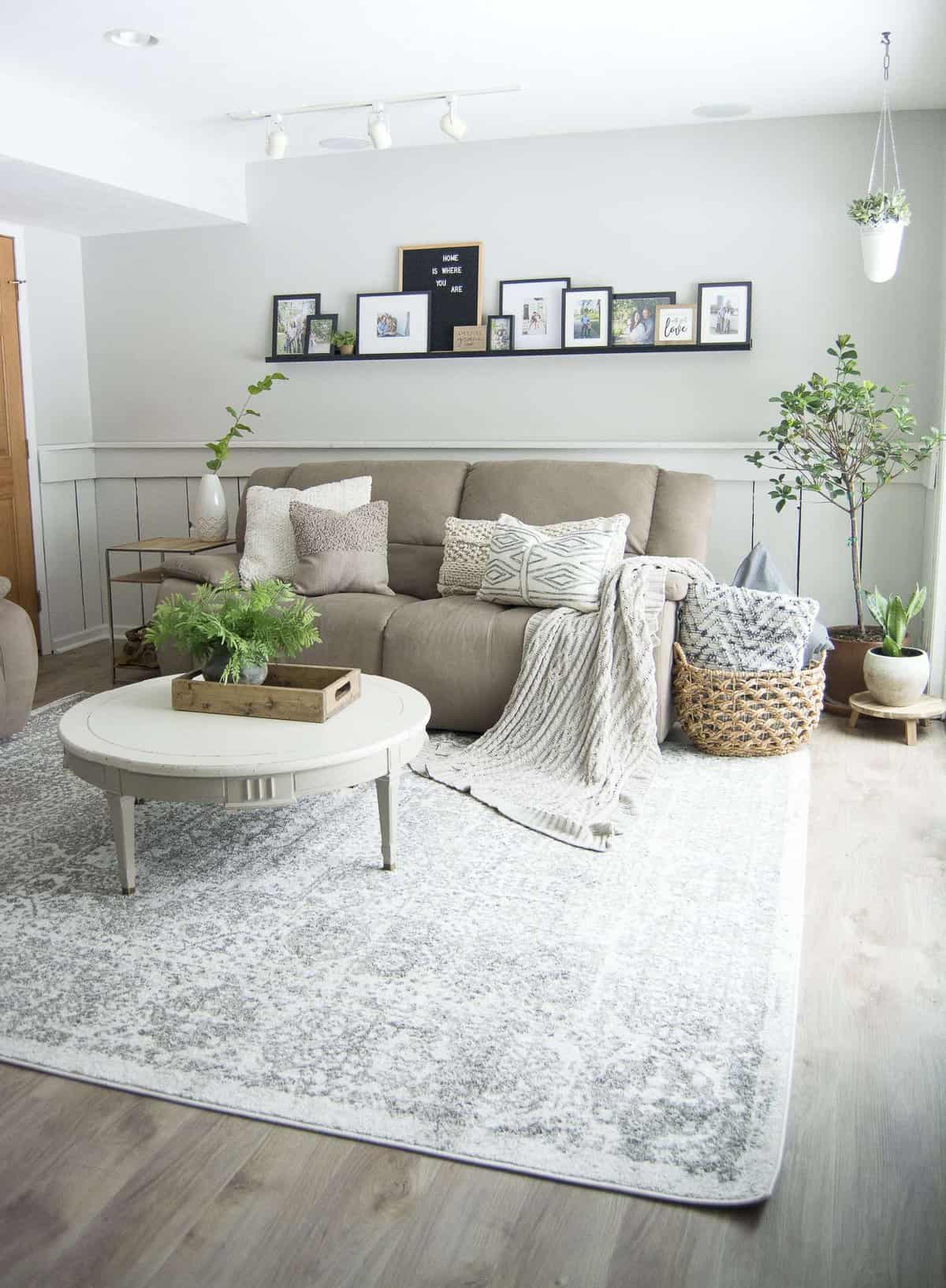 Do you struggle to keep your family room pretty and practical? Today I'm sharing my family room design and how I make it work for an active family of four. #fromhousetohaven #familyroomdesign #livingroom #homedecor