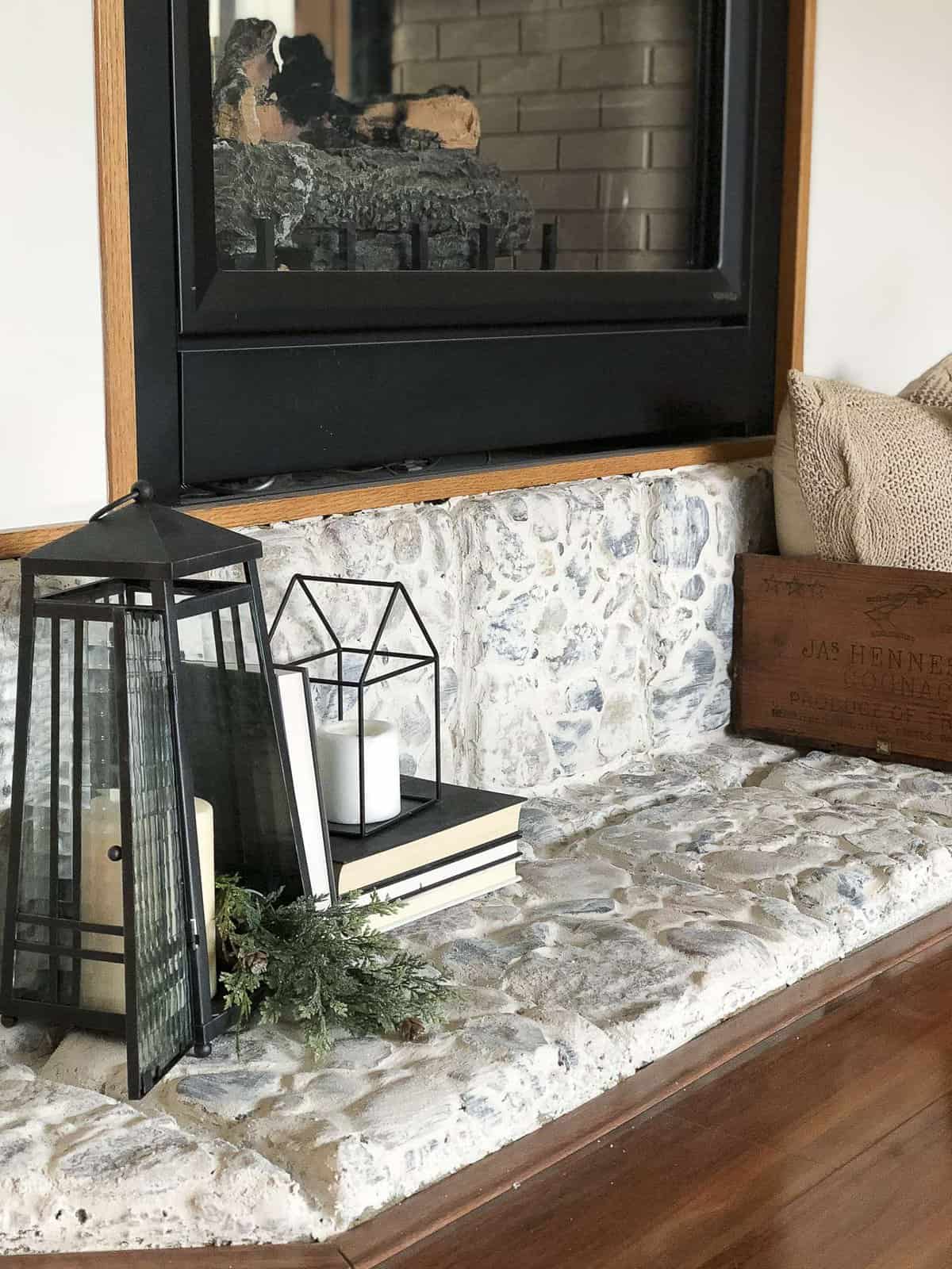 Are you looking for an easy way to update a river rock hearth? Try the german schmear technique to transform outdated rock to beautiful European country style. #germanschmear #fireplace #diyfireplace