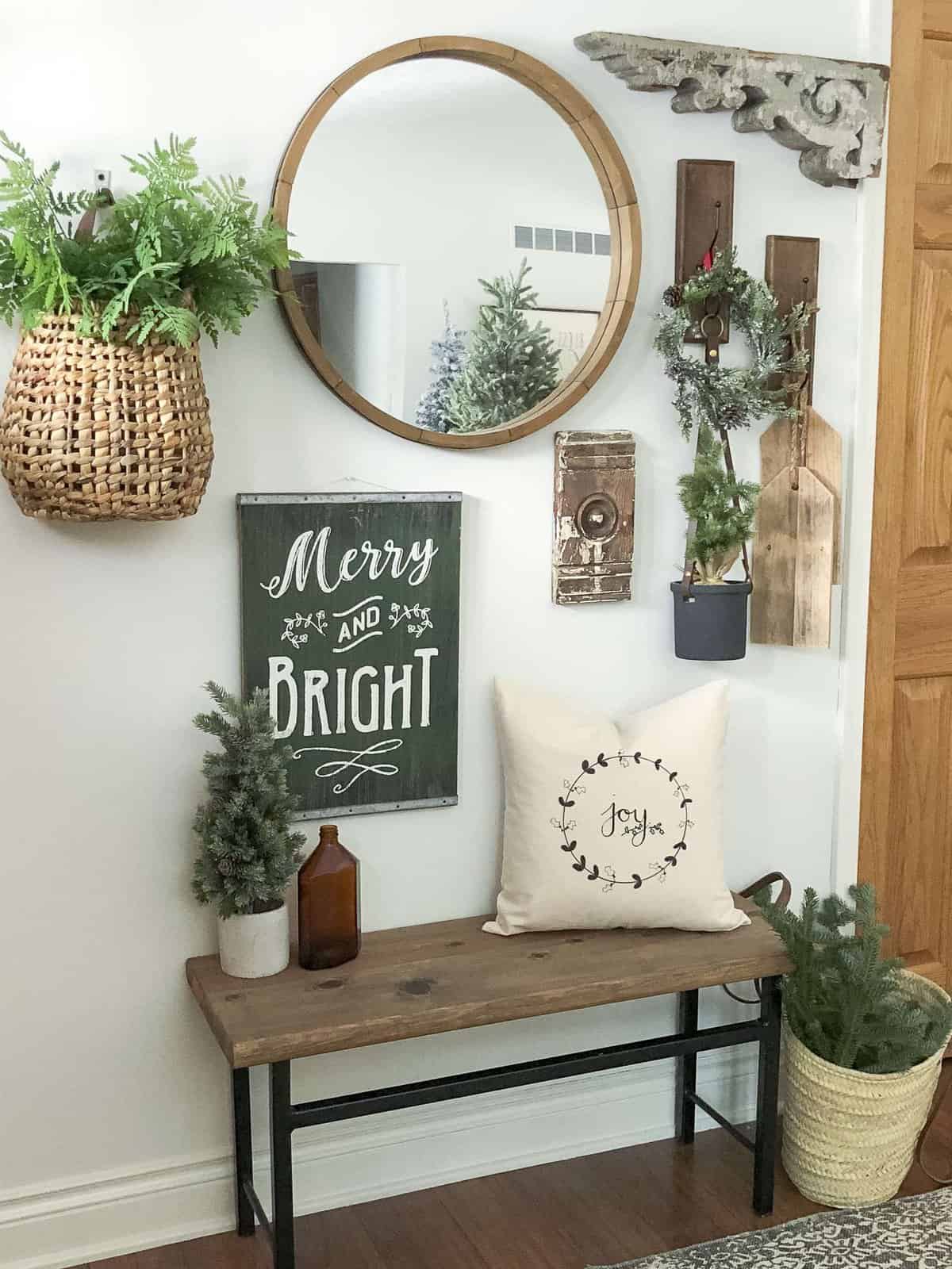 Do you have a small entryway? Today I'm sharing easy tricks and tips to style an entry with simple Christmas entryway decor. #entrywaydecor #christmasdecor #simplechristmasdecor #fromhousetohaven