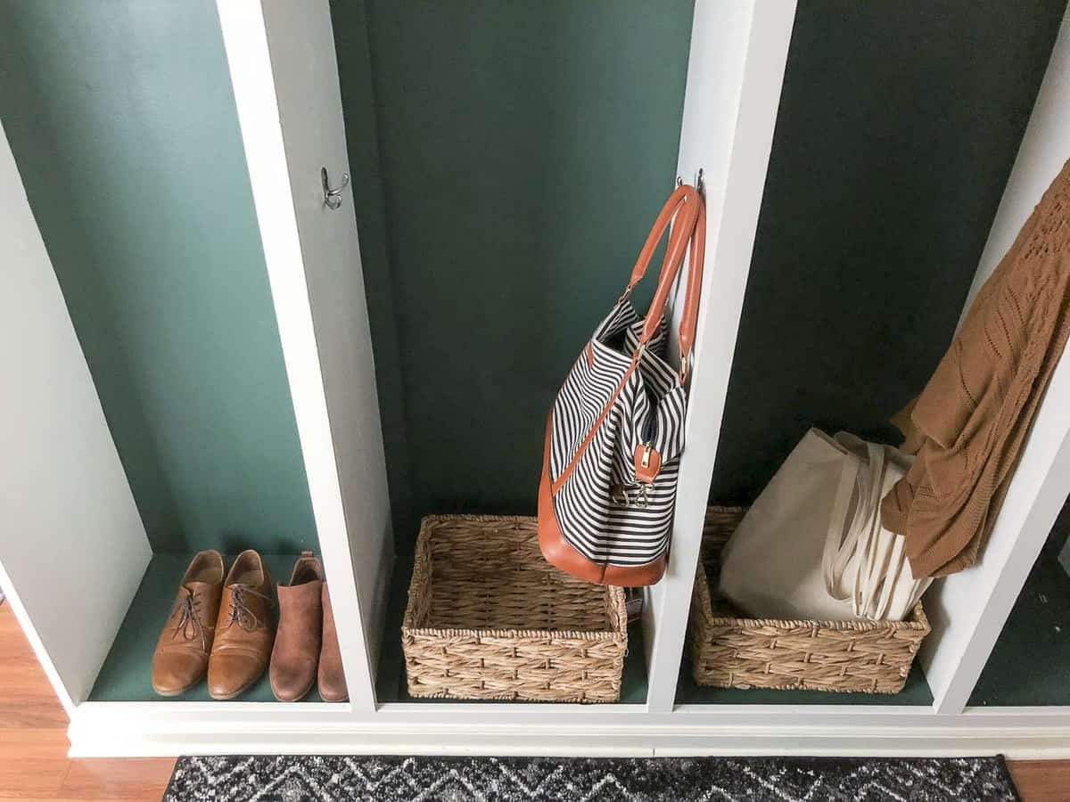 Do you have a small mudroom that's constantly overloaded with clutter? I'm sharing 4 must haves for small mudroom design plans to help you get organized.  #fromhousetohaven #mudroomdesign #mudroomdecor