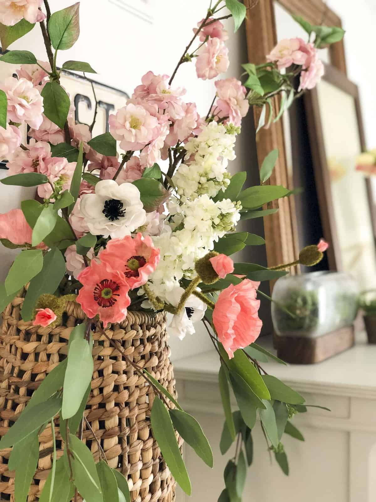 Are you trying to arrange faux flowers without having to stick to the traditional vase arrangement? See 5 non-traditional ways to arrange faux flowers! #fromhousetohaven #fauxflowers #artificialflowers