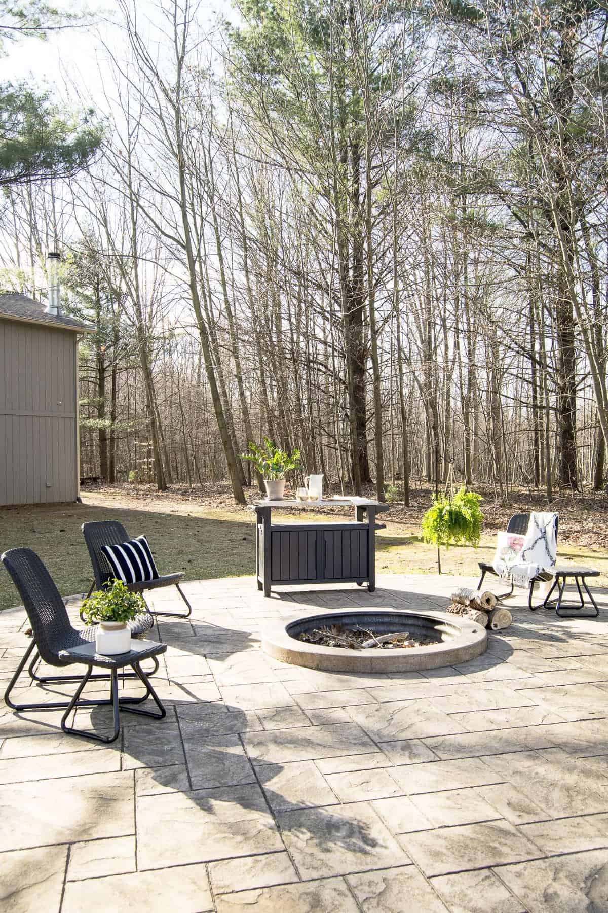 Are you excited for outdoor entertaining? Today I'm sharing my stamped concrete fire pit design plan as I gear up for the warm weather season! #fromhousetohaven #stampedconcrete #patiodesign #firepit