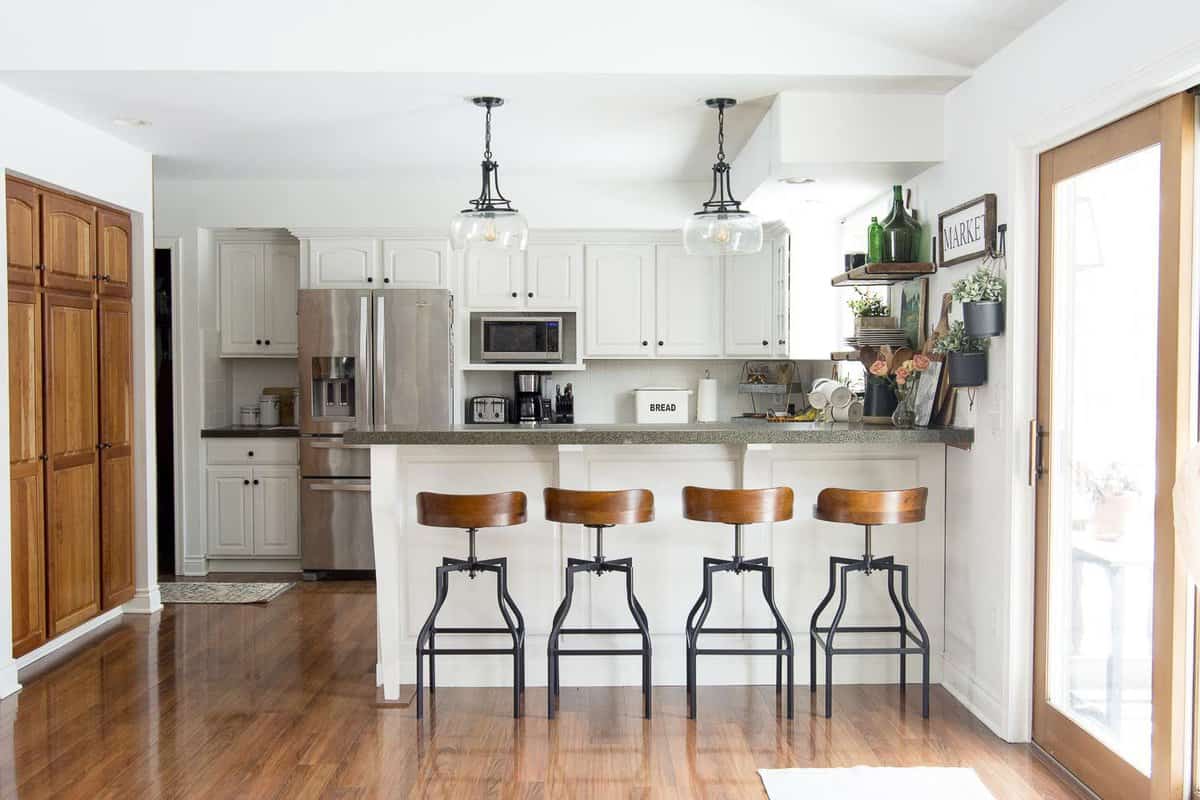 Open shelving is the new standard for modern kitchens. Learn simple and easy tips for how to decorate kitchen shelves no matter your style. #fromhousetohaven #kitchendecor #kitchenshelves #openshelving