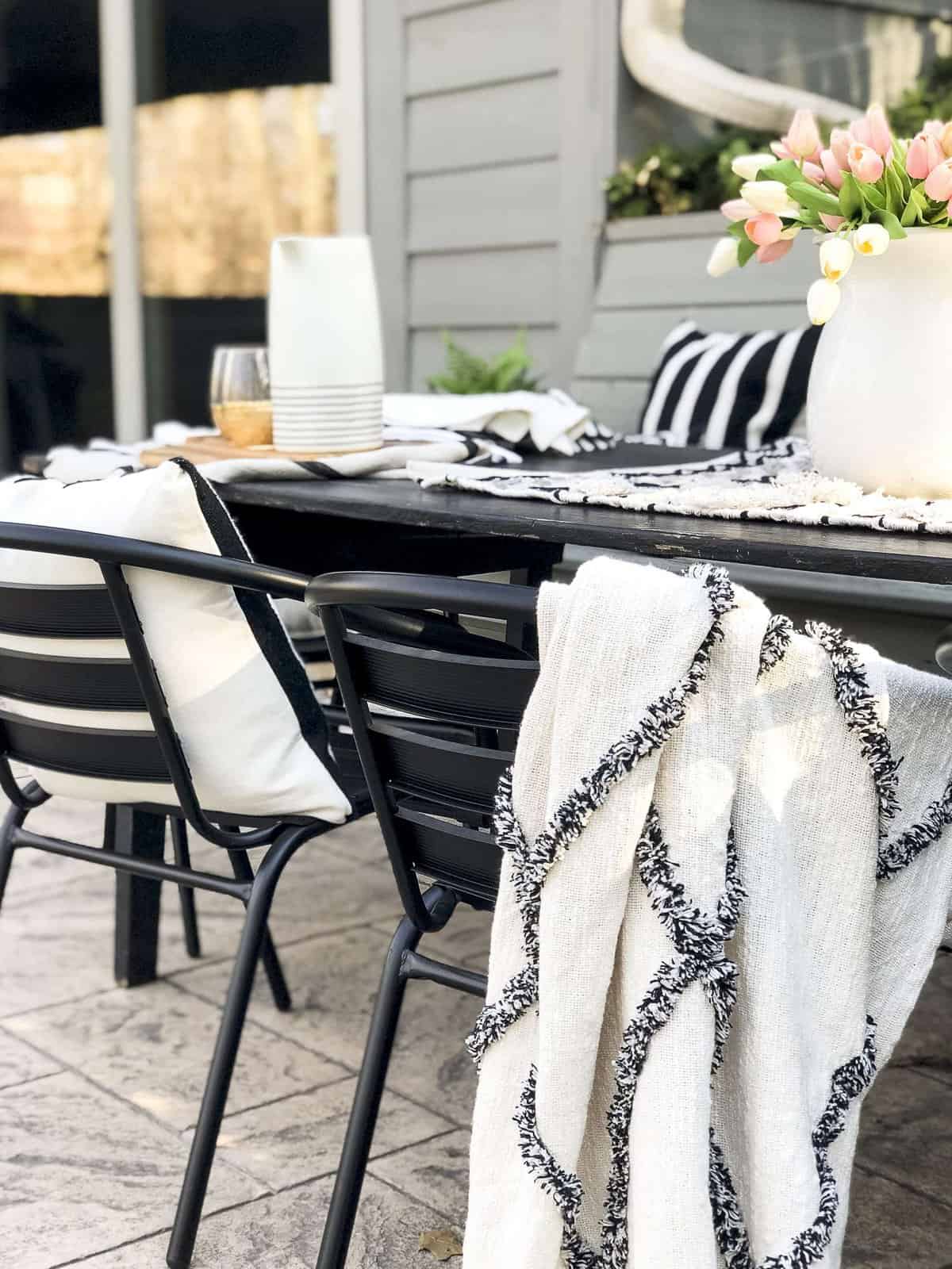 Do you love outdoor entertaining? Today I'm sharing simple ways to style your back patio with durable furniture and effortless decor for easy entertaining. #fromhousetohaven #patiodecor #outdoordining #backpatio