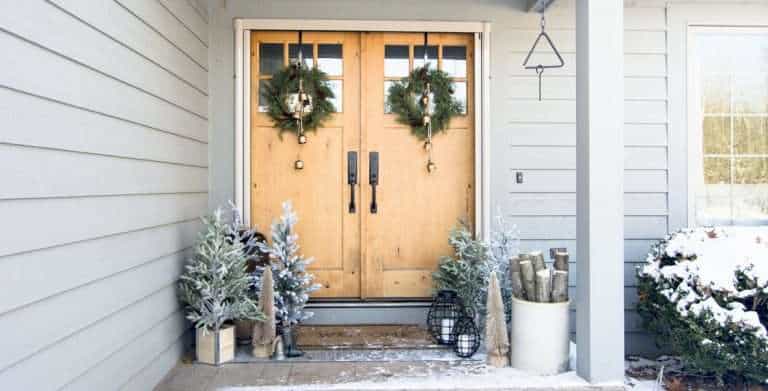 Learn how to create a 5 minute grand entrance with these simple front porch Christmas decorations. Welcome to the tree farm!