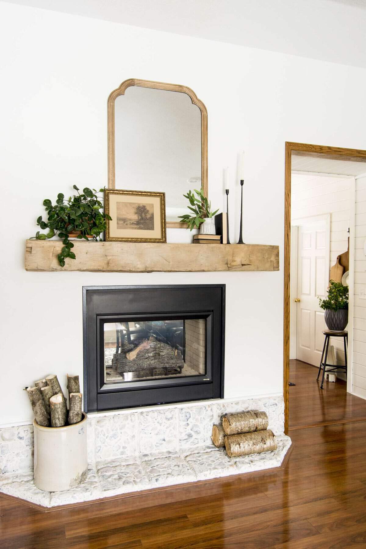 Modern farmhouse barn beam mantel decor.