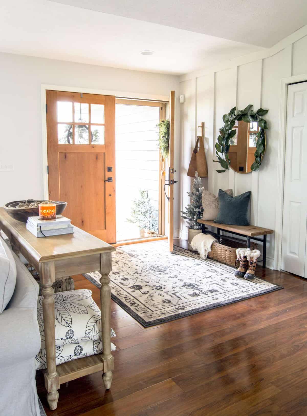 Narrow entryway bench with pillows.