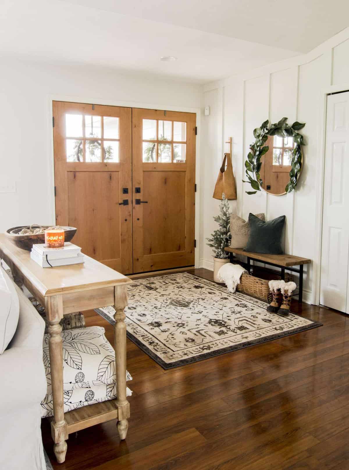 Winter decor with a narrow entryway bench.