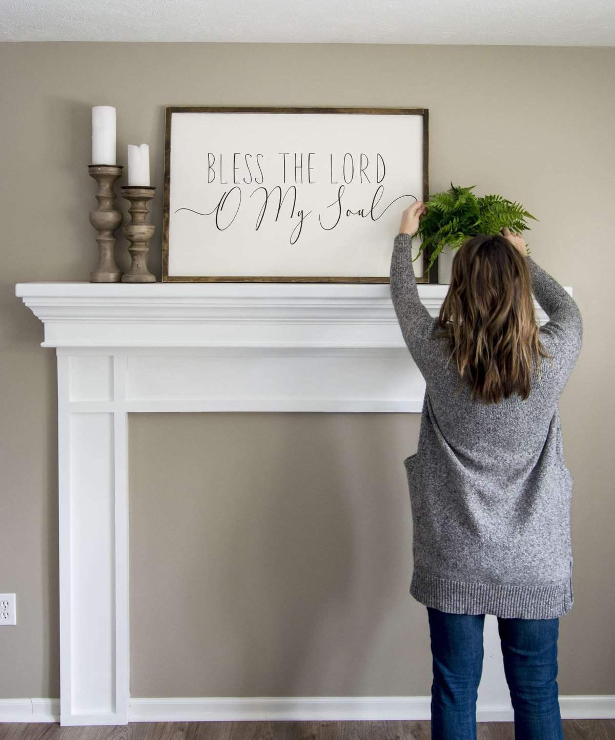 Adding a faux fireplace mantel instantly creates a focal point and cozy atmosphere in a room. Learn how to build a DIY fireplace mantel in any room!
