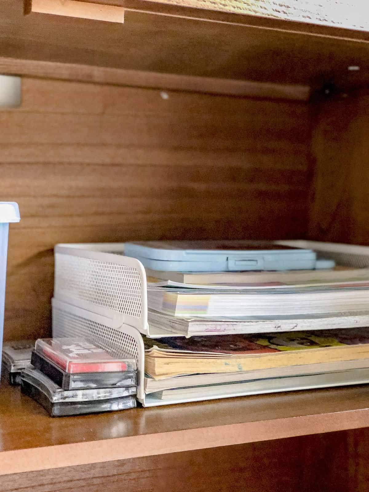 Metal bins for paper storage.