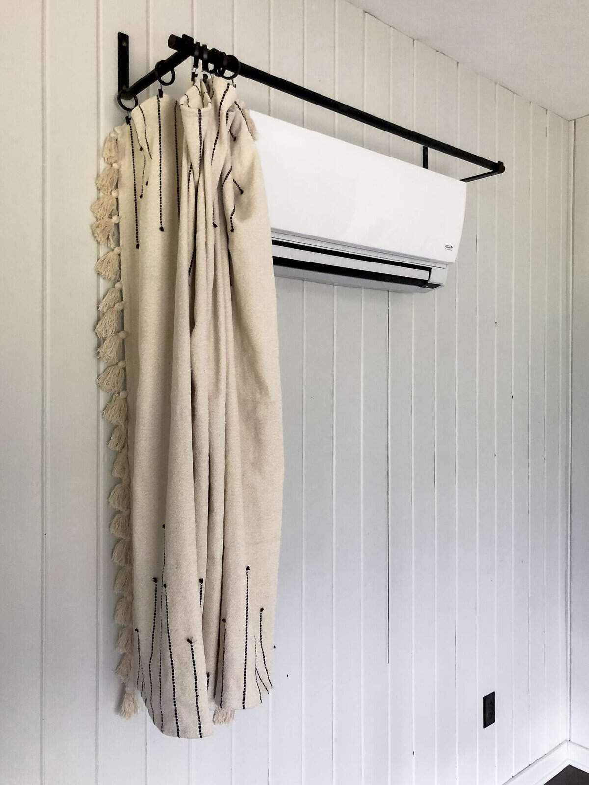 How to hide a wall heater with a blanket.