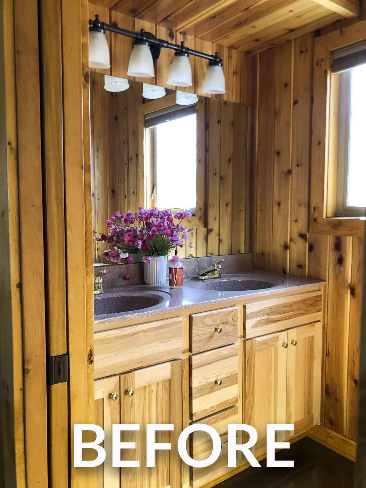 Pink countertops with knotty pine walls.