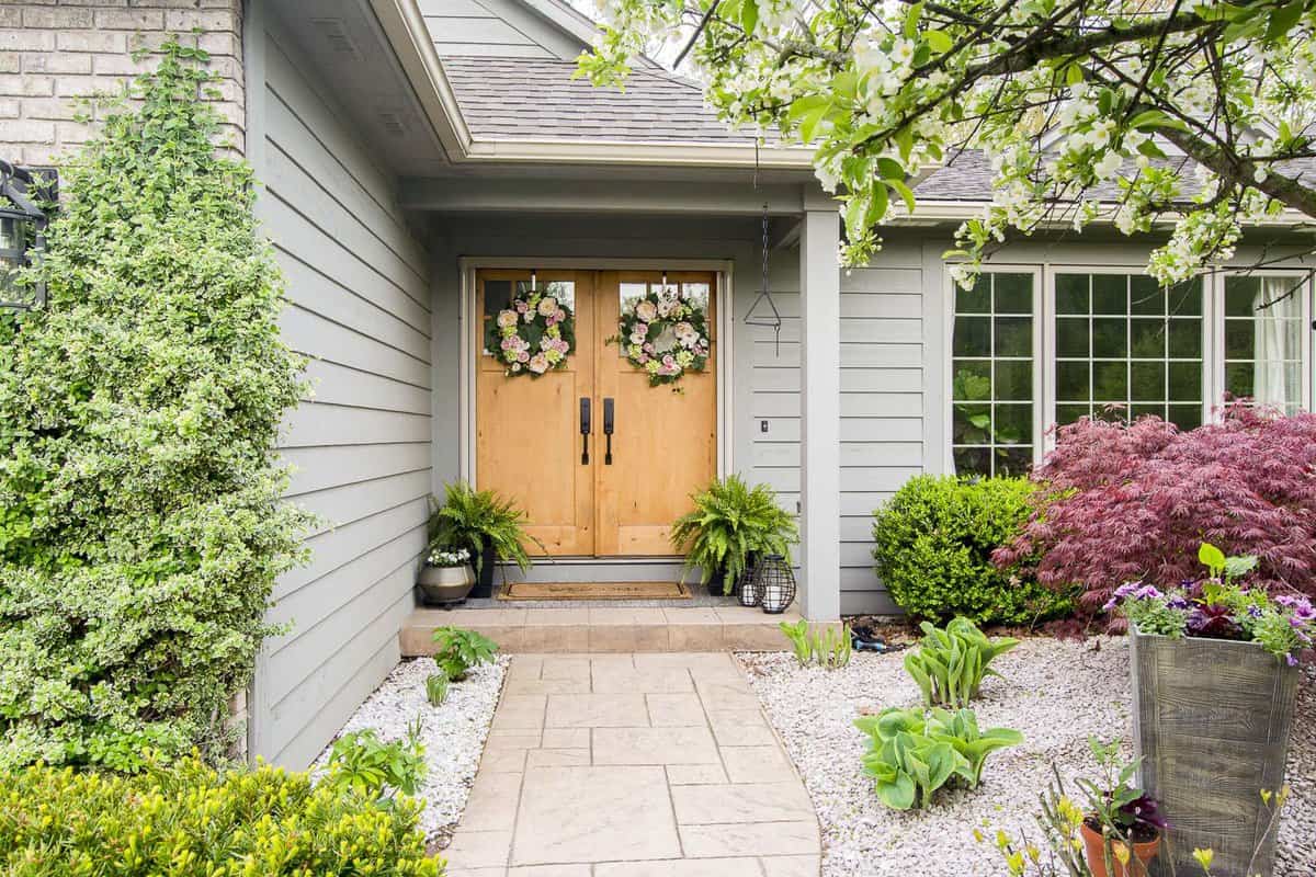 Perennial garden leading up to a front porch.