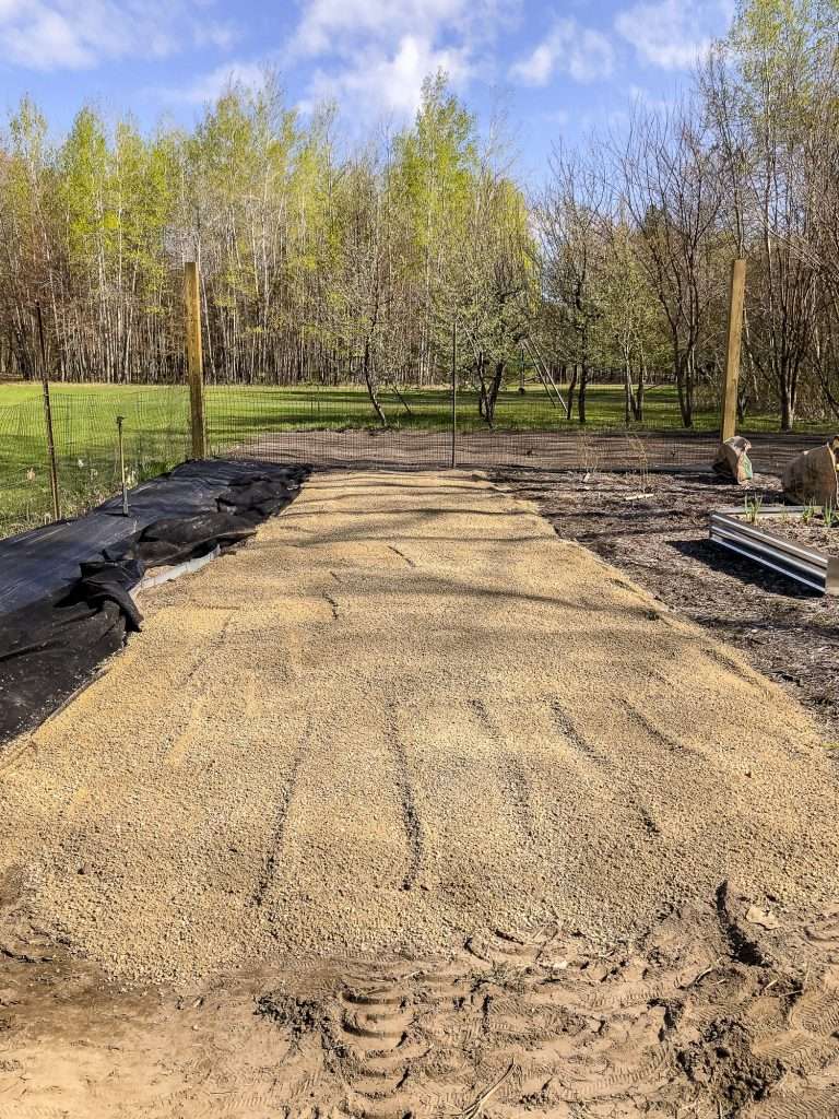 Add gravel to the flagstone pathway.