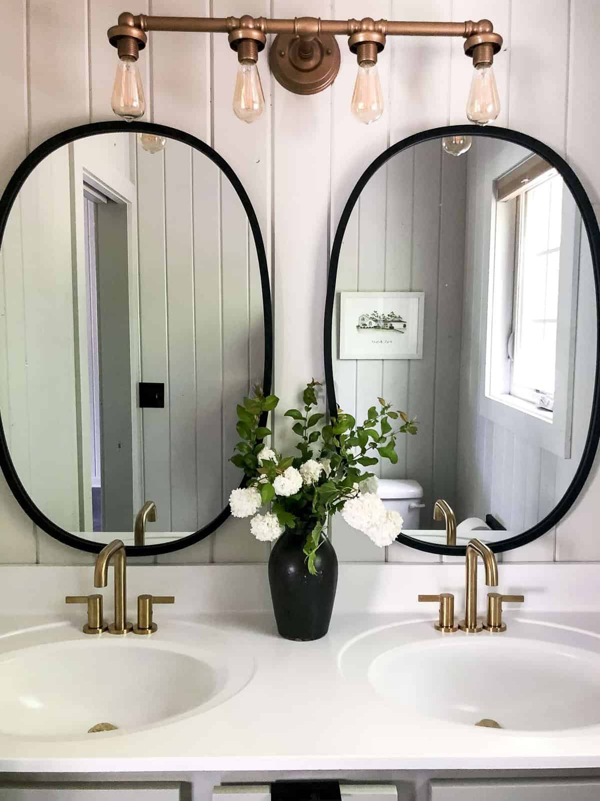 Double mirrors over a budget friendly vanity.