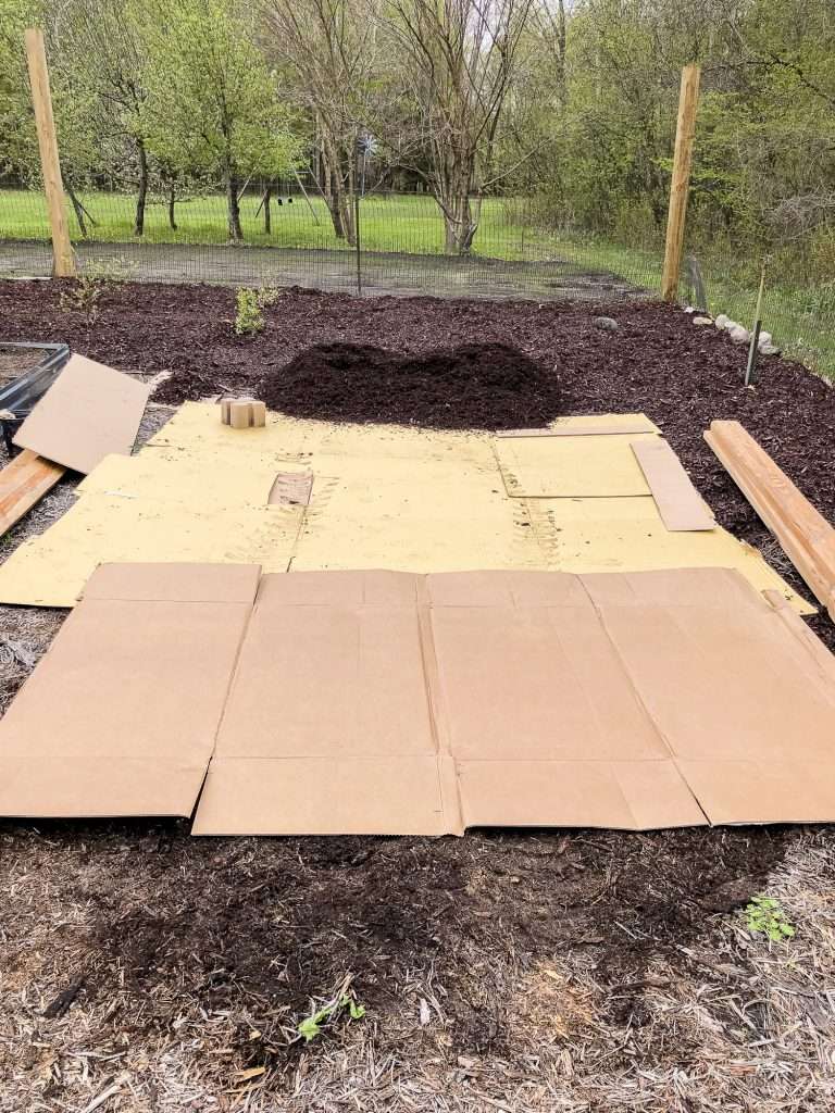 Weed barrier for a raised garden bed.