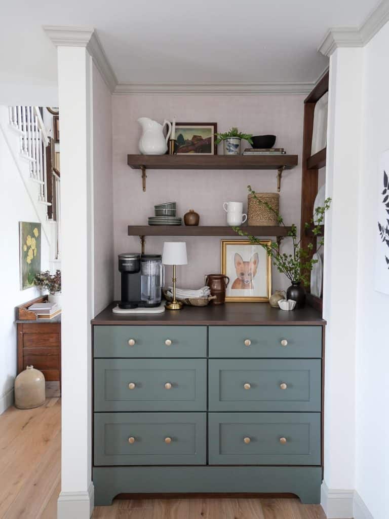 Painted crown and baseboard trim around a coffee bar.