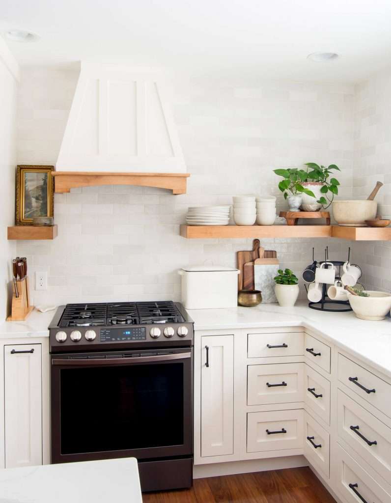 White kitchen cabinets and open shelving.