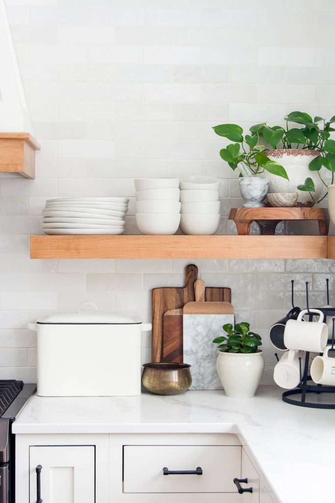 Dishes on a floating shelf.