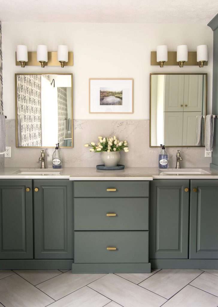 Green bathroom vanity with mixed metal finishes