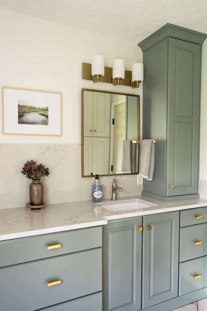 Bathroom remodel with green vanity.