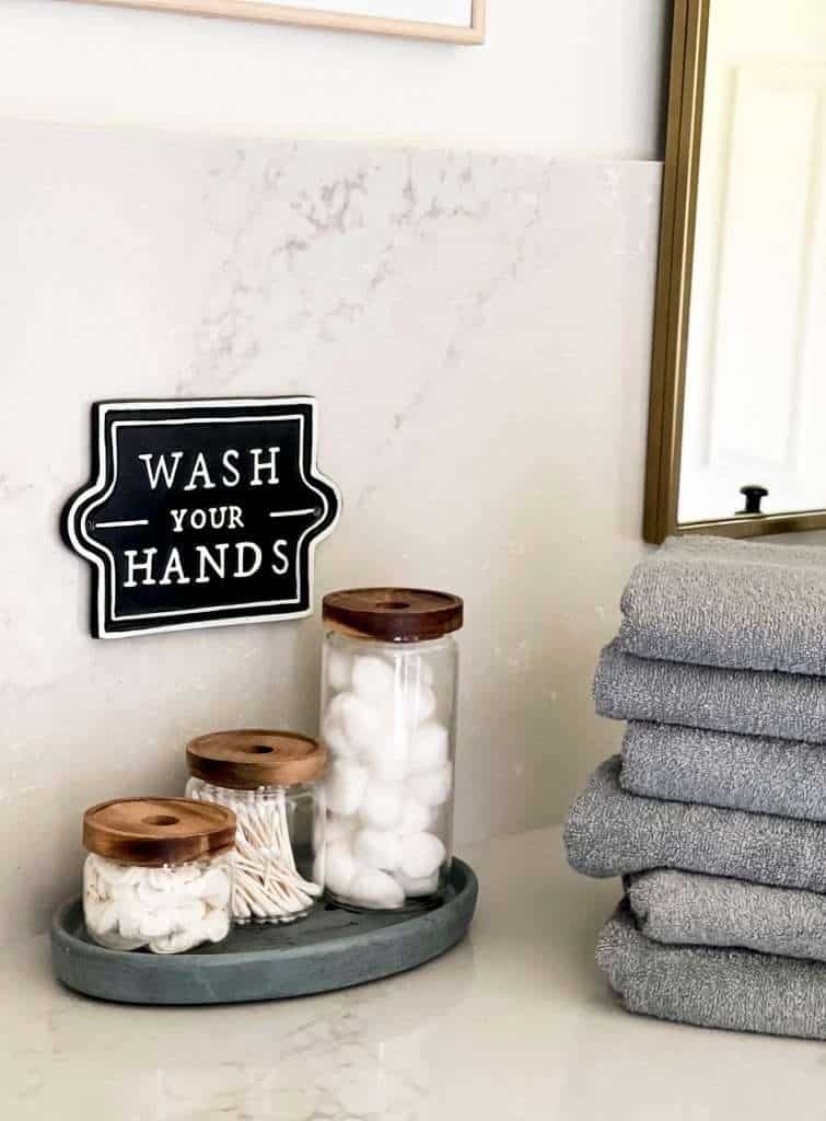 Canister set in a bathroom.