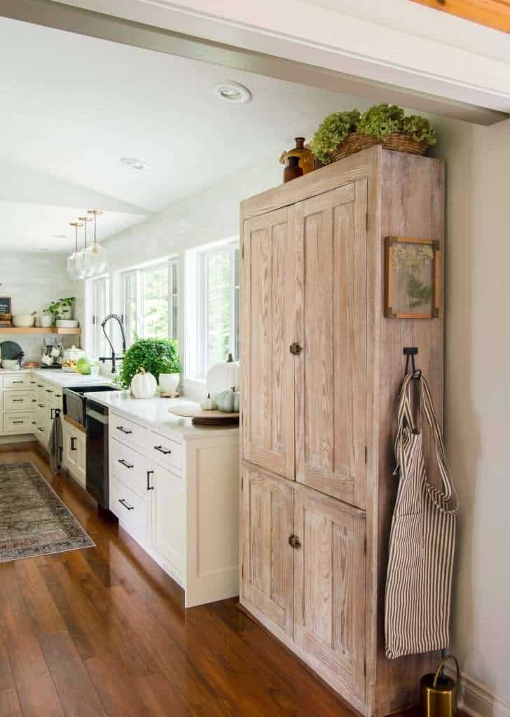 Lightened wood cabinet in a kitchen.