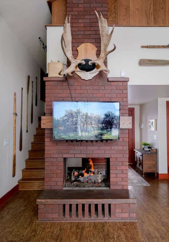 Brick fireplace before being painted.