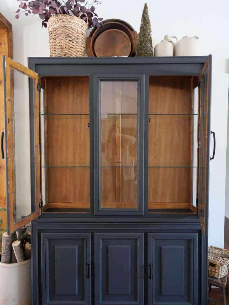 Blank slate in a china cabinet.