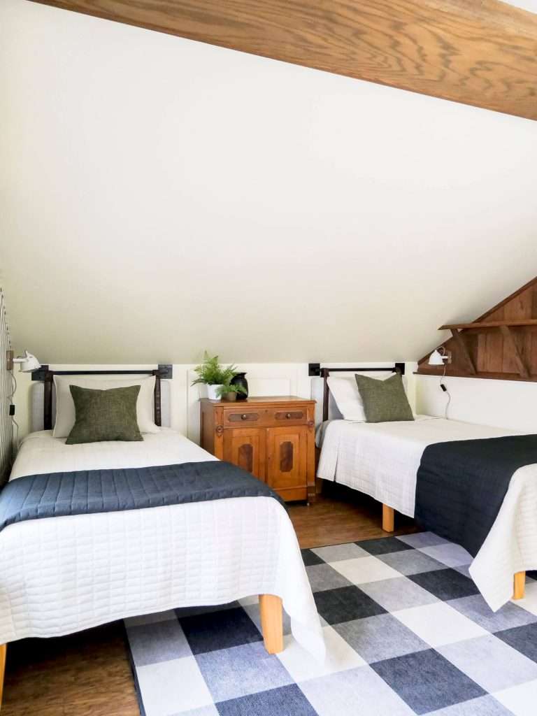 Double twin beds in a loft space.