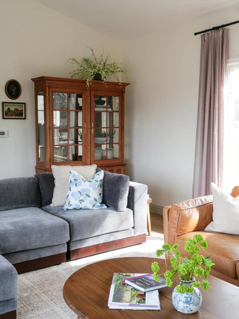 Blue sofa in a living room decorated for spring.