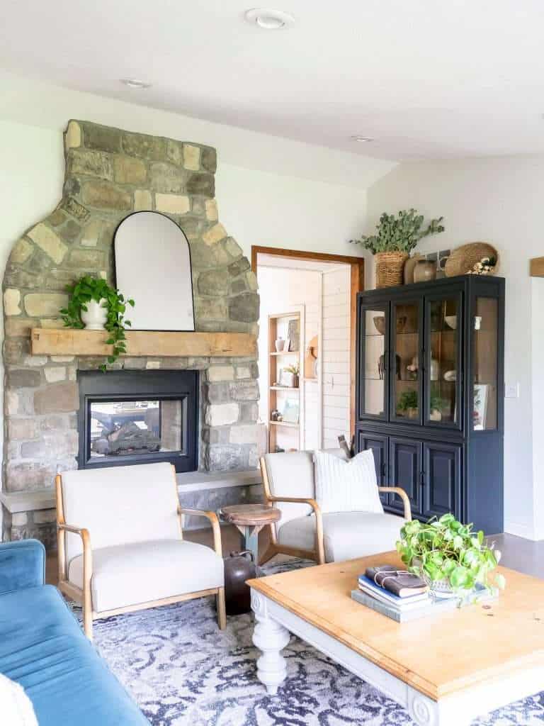 Stone fireplace with coffee table.