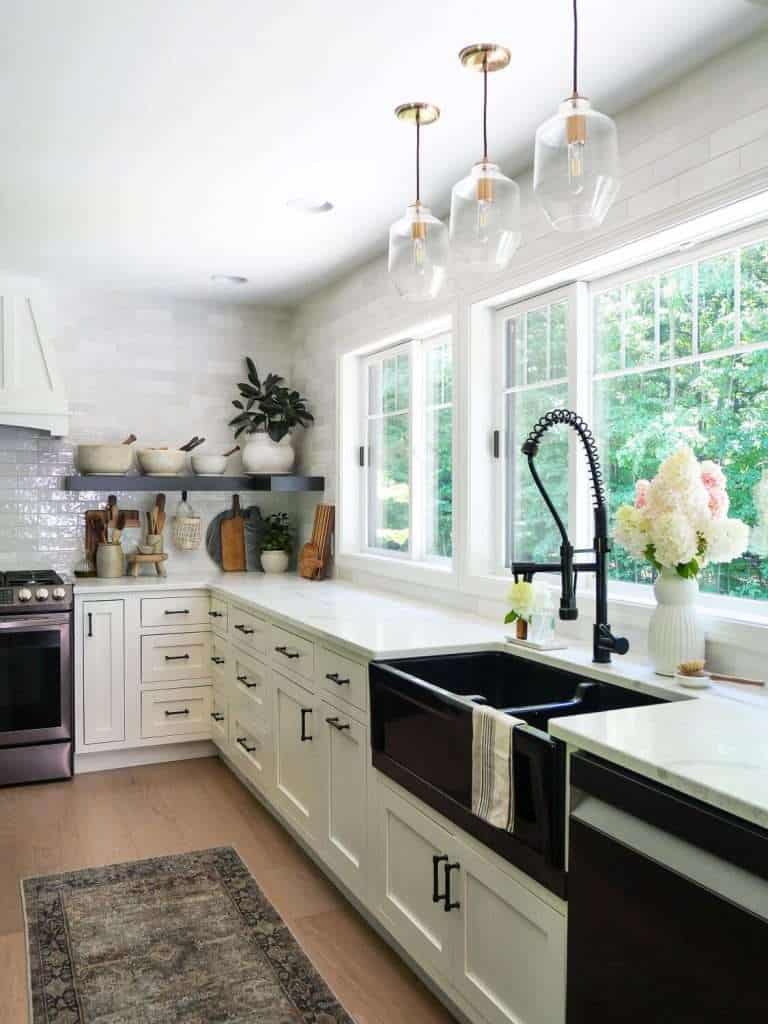 Black kitchen sink with countertops.