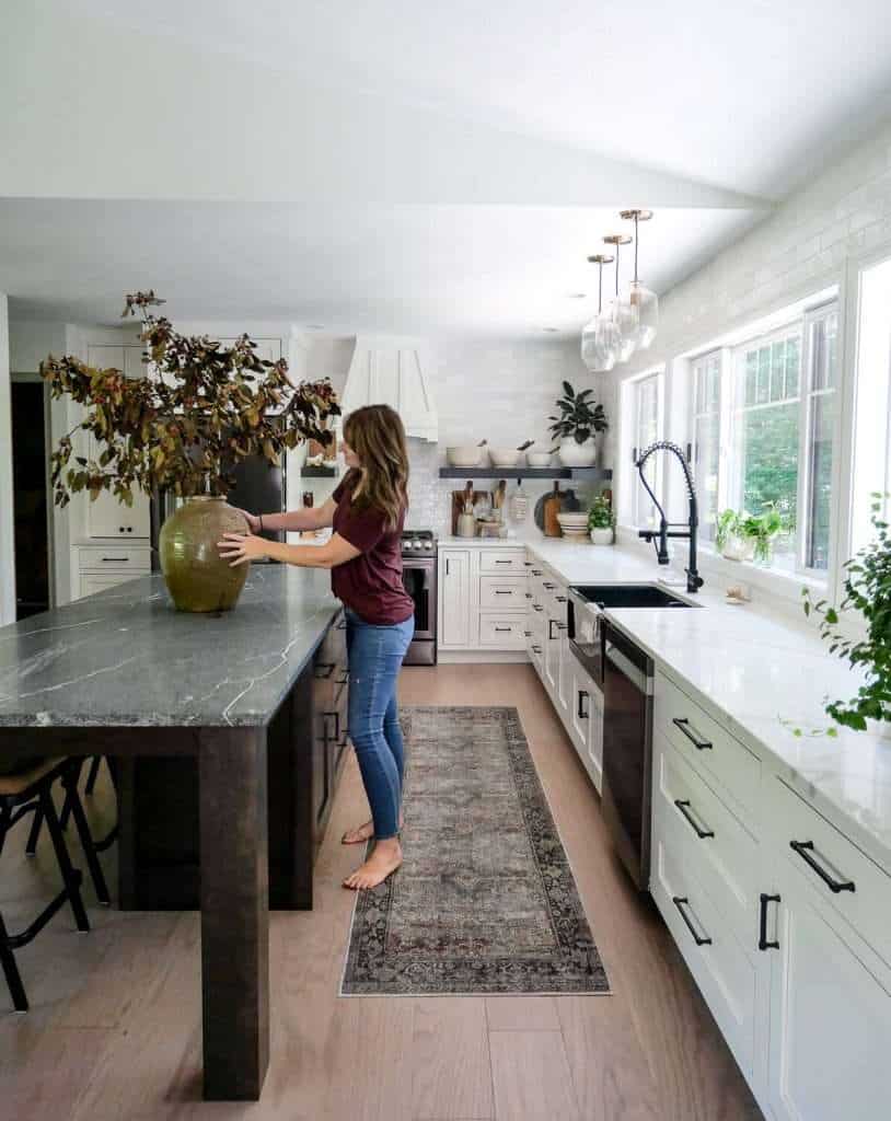 Kitchen with large island and granite countertop.