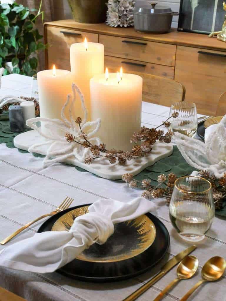Group of pillar candles on a dining table.