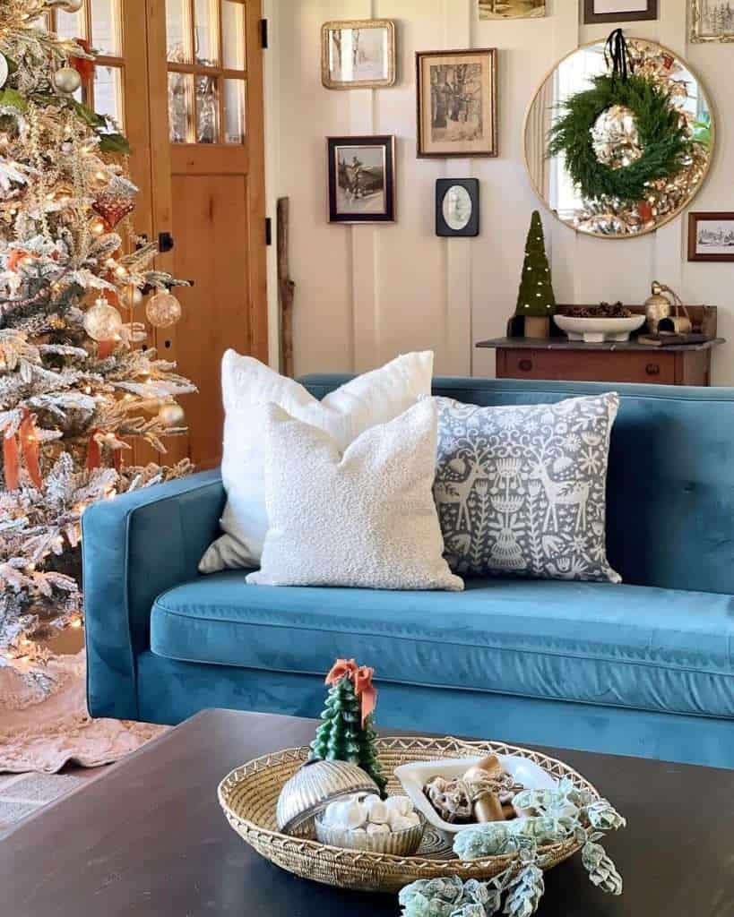 A coffee table centerpiece decorated for christmas.