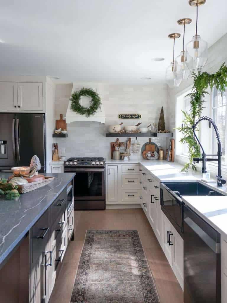 View looking down a kitchen island decorated for christmas.