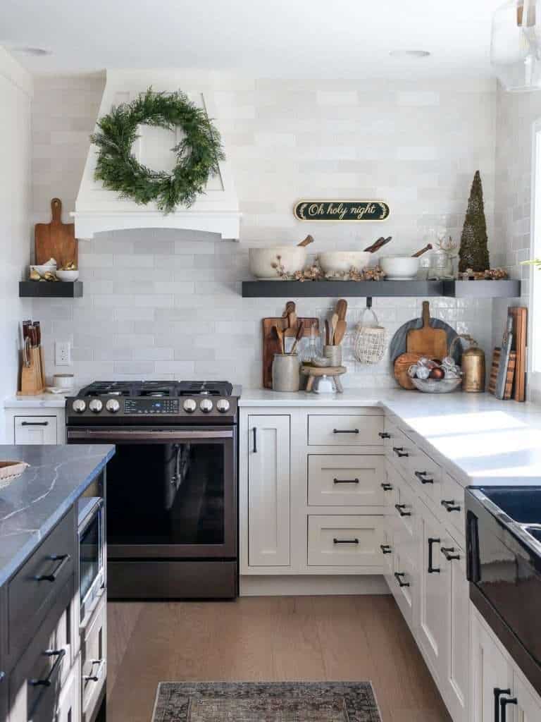 Kitchen decorated for Christmas with vintage mortar and pestles.