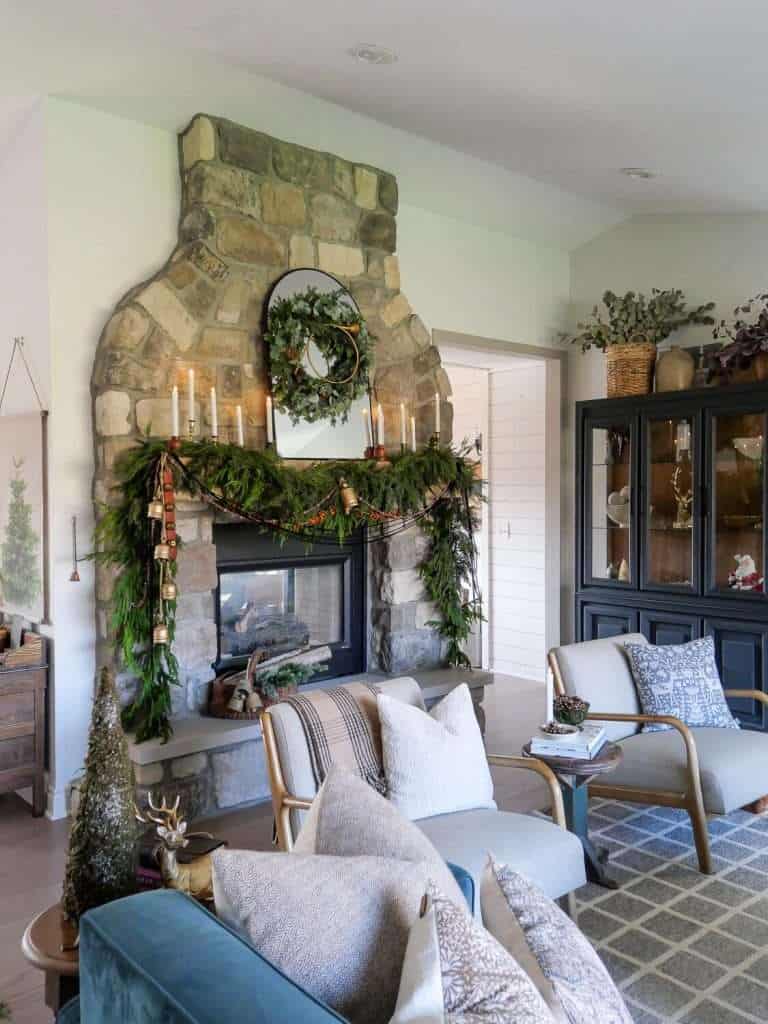 Stone fireplace with decorated mantel.